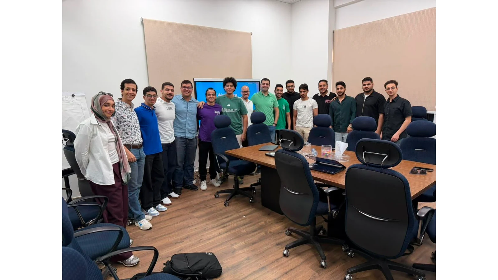 Ejada Cloud Build internship cohort and mentors gathered in a Cairo meeting room